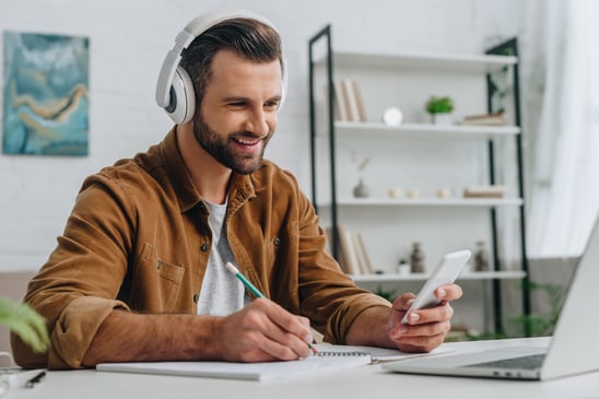 man-working-at-desk-wearing-headphones-2026-01-06-00-44-53-utc; Sureway Transportation Company