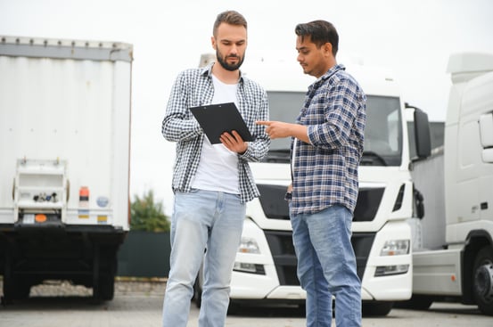 two-men-discussing-logistics-near-a-truck, Sureway, transportation, logistics, agents